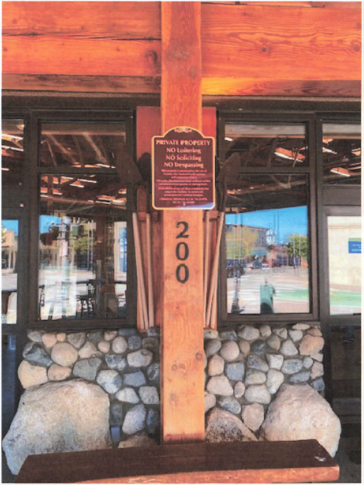 No Trespassing Sign over the numbers 200 near front entrance