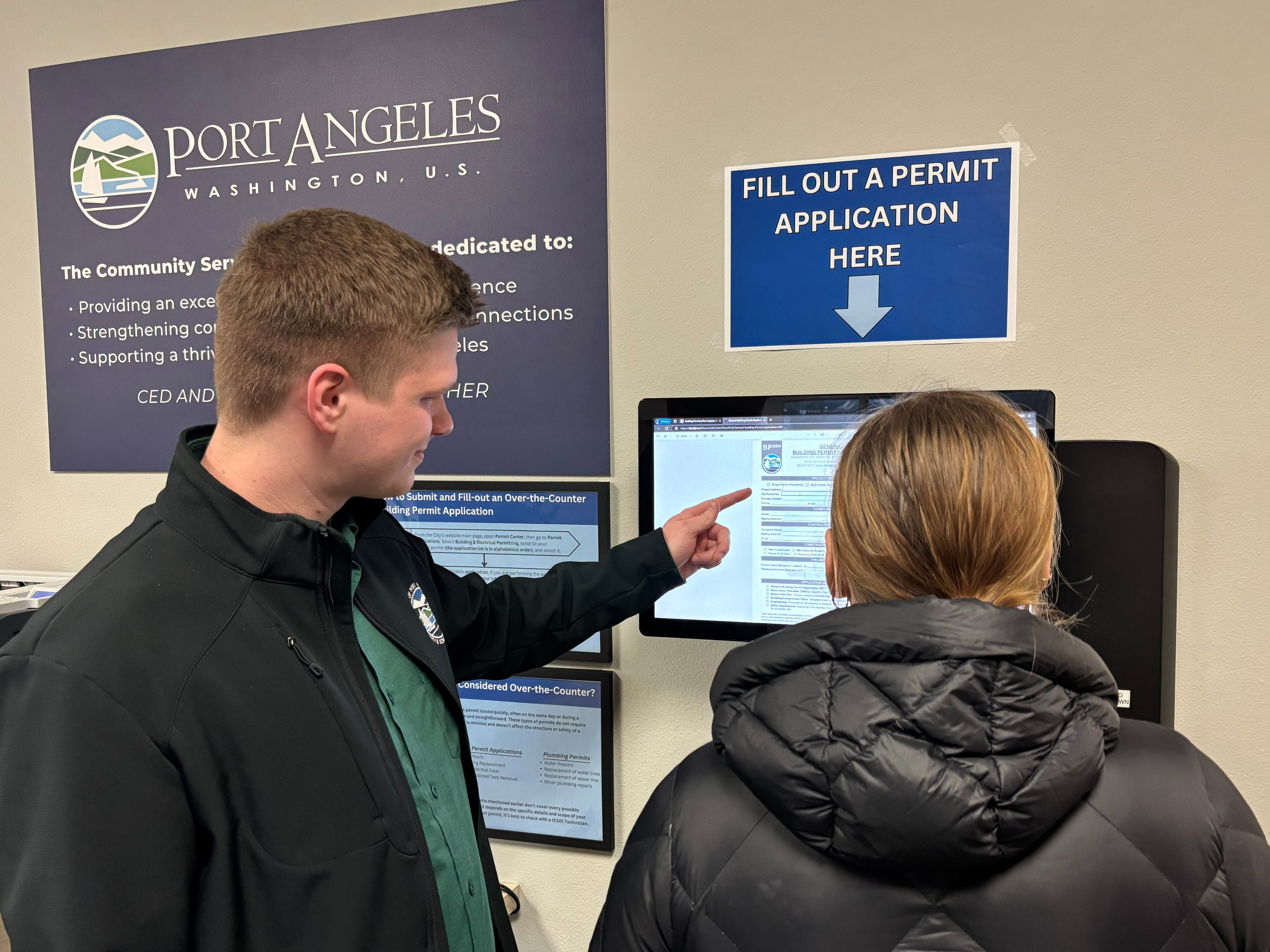 Permitting Technician assists customer