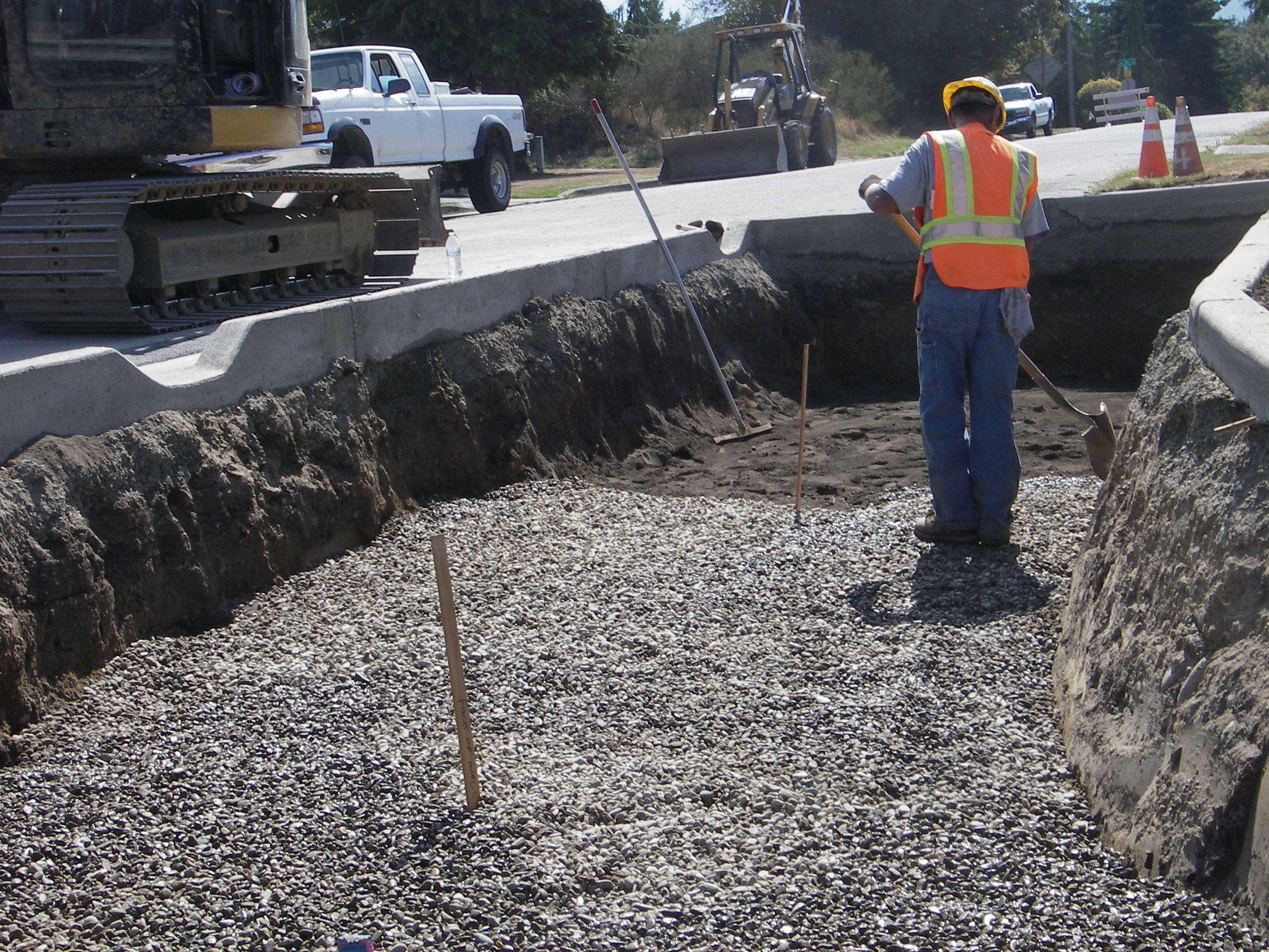 Excavation and placement of underdrain sand and rock